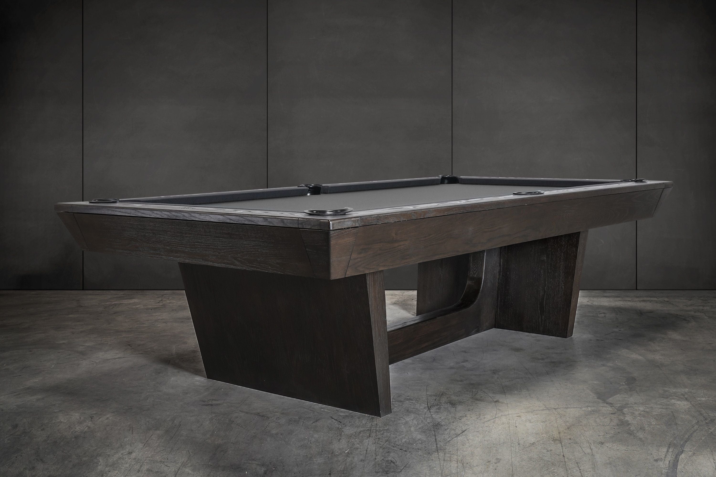 Nixon KAI 7' Slate Pool Table in Waxed Brown by Nixon Billiards shown on a concrete floor.