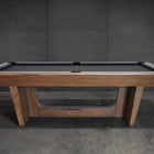 Nixon KAI 8' Slate Pool Table in Walnut by Nixon Billiards, shown with dark felt and gray wall.