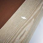 A white diamond sticker on sandwashed wood near a Brunswick Billiards Sagrada 8' pool table.