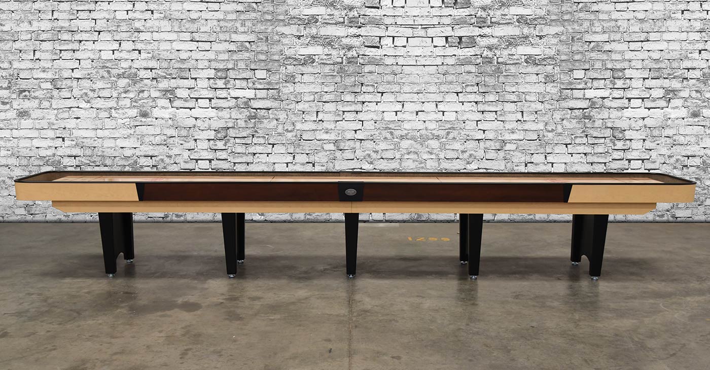 Venture Classic 14' Shuffleboard Table with black legs against a white brick wall background.