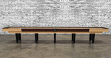 Venture Classic 14' Shuffleboard Table with black legs against a white brick wall background.
