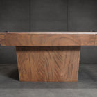 Nixon KAI 8' Slate Pool Table by Nixon Billiards in walnut finish, set against a dark wall.
