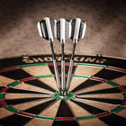 Three Viper Sinister 25g tungsten steel tip darts cluster in the bullseye of a sisal dartboard.