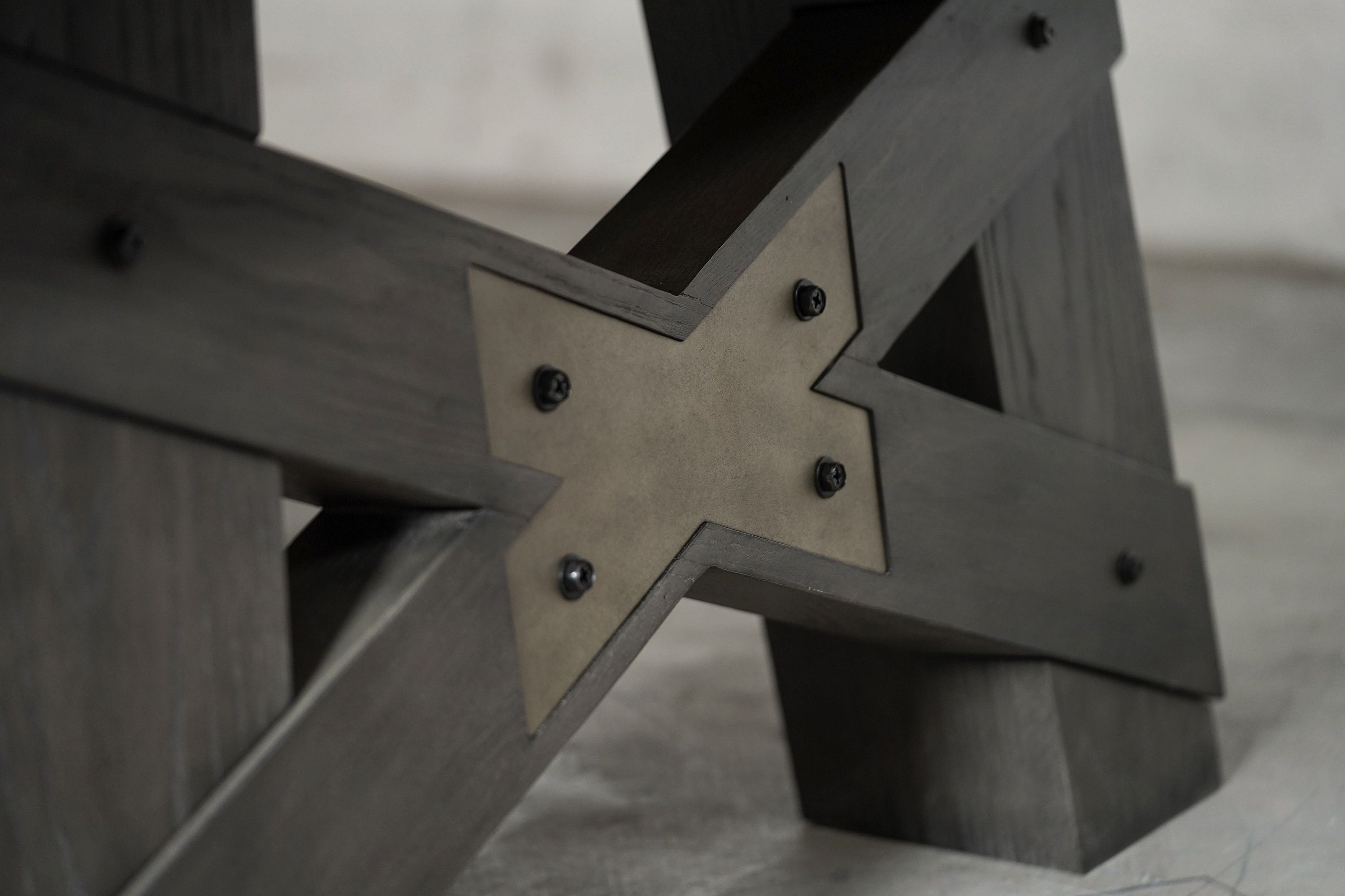 Close-up of Nixon Billiards’ Georgia 8' pool table leg in Grayson Grey with metal X-plate.